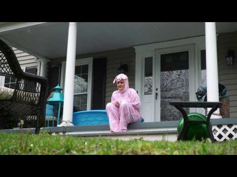 A Virginian plays dress up on her front porch to provide a little cheer