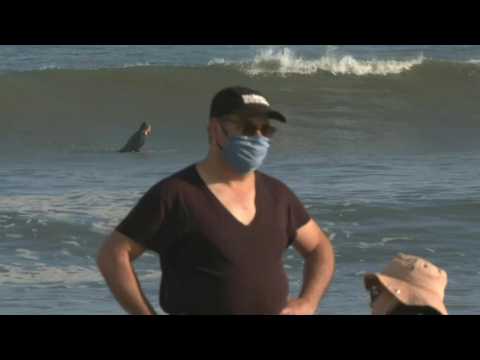 New Yorkers head to Rockaway Beach as coronavirus cases decline