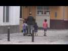 Children enjoy strolling through Seville
