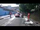 Workers clean streets of Rio favela to contain spread of coronavirus