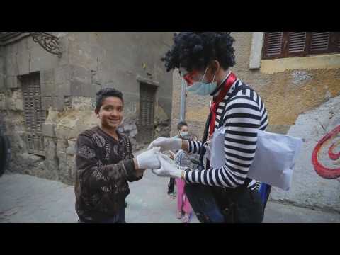 A clown teaches children how to wear masks and gloves in Cairo