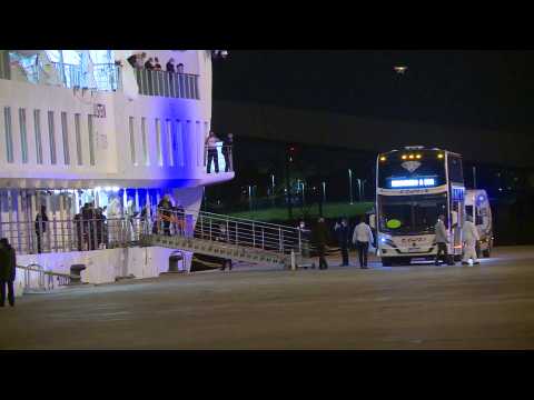 Passengers from COVID-19 hit cruise disembark at Montevideo port