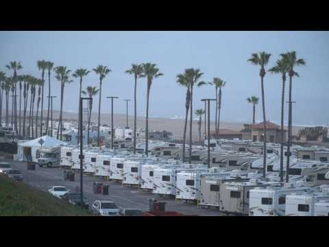 Day breaks over a beachside RV park where Covid-19 patients are confined