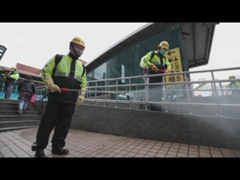 Volunteers clean Taiwan streets with disinfectant to contain COVID-19