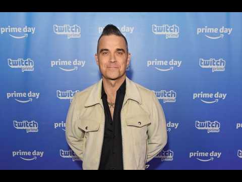 Robbie Williams hasn't seen ghosts since becoming a dad