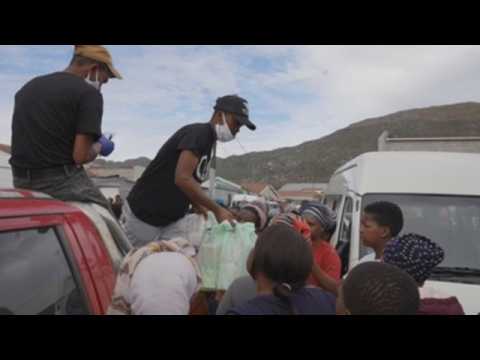 Volunteers distribute food among vulnerable families in Cape Town