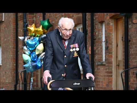 British veteran, 99, raises millions for NHS as he completes garden walk challenge