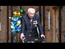 British veteran, 99, raises millions for NHS as he completes garden walk challenge