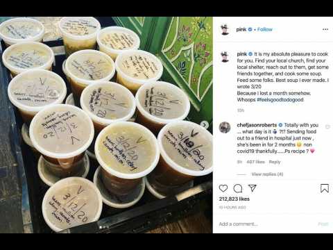 Pink donating homemade soup to those in need