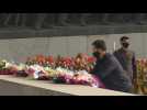 Masked N. Koreans mark late founder Kim Il Sung's birthday
