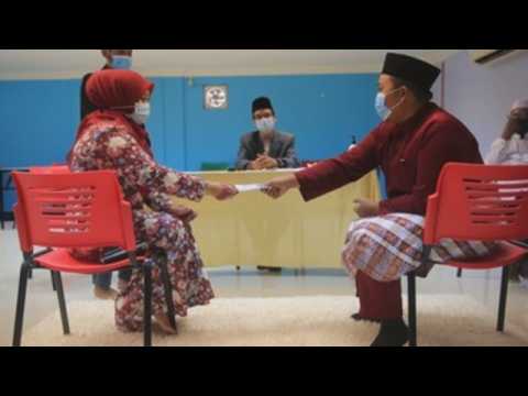 Muslim couples in Malaysia get married amid social distancing measures