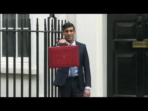 British Chancellor Rishi Sunak presents the budget red box