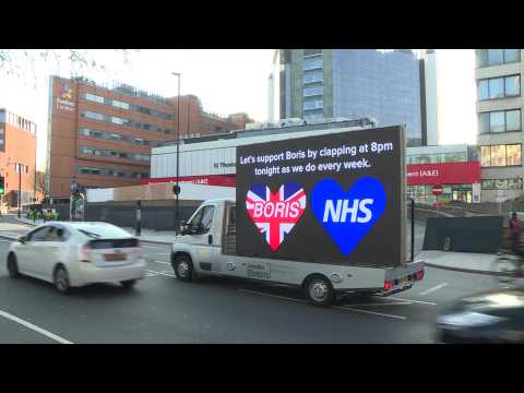 Messages of support for COVID-19 stricken Boris Johnson displayed on LED screen outside London hospital