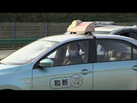 Coronavirus: Drivers at Wuhan road checkpoint as authorities lift exit ban