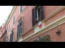Italians sing the national anthem out of their windows in Rome amid virus lockdown