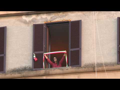Italians sing from their windows amid nationwide lockdown