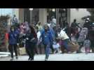 Migrants rush for aid supplies at quarantined Greek hotel