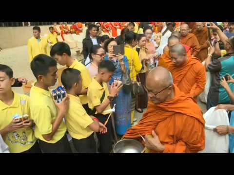 Thai cave boys attend alms-giving ceremony