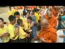 Thai cave boys attend alms-giving ceremony