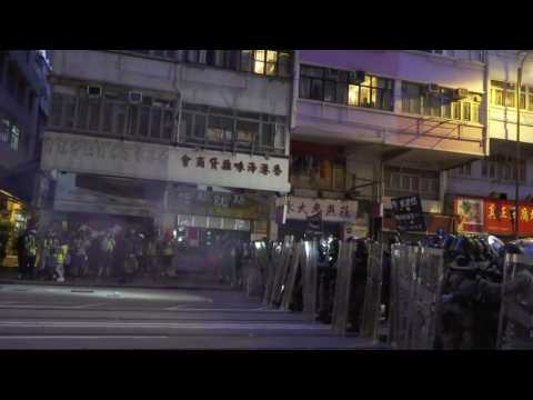 Hong Kong police tear gas protesters near Beijing liaison