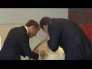 Macron and Vucic look at globe in Serbian Presidential Palace