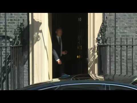 Theresa May leaves Downing Street for parliament on her last day in office