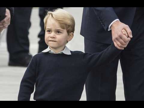Prince George gets tennis lesson from Roger Federer
