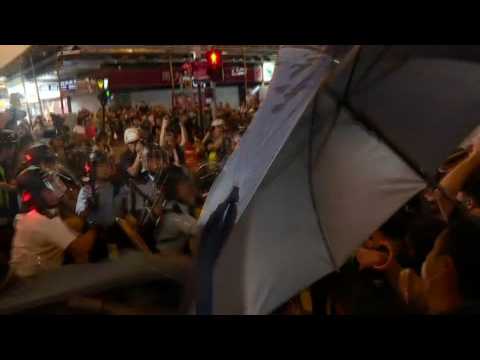 Riot police baton charge Hong Kong protesters