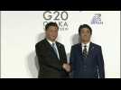 Xi and Abe shake hands at G20