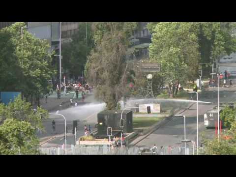 Chilean police fire water cannons at protesters in Santiago