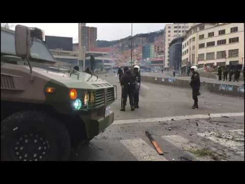 Bolivian police stand guard after violent clashes in La Paz