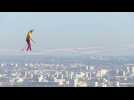 Paris: tightrope walker hovers 150 m above ground, crossing the void between towers in the business district