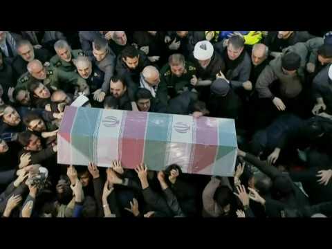 Mourners carry Soleimani's coffin during a ceremony in Tehran