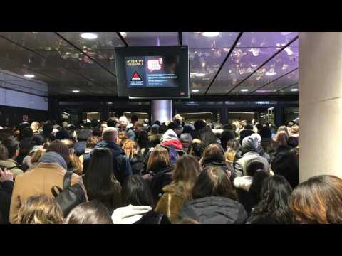 Passengers cram into Paris metro station amid transport strike chaos