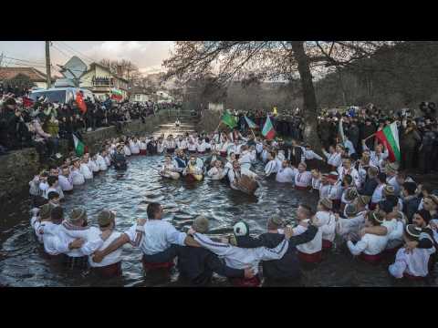 Orthodox Christian worshippers mark Epiphany with icy dance for good health