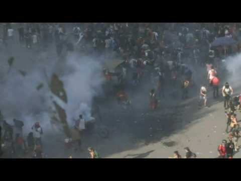 Police in Chile fire tear gas on protesters in Santiago plaza
