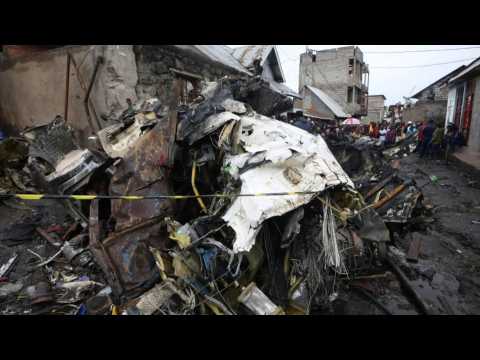 People examine site of deadly plane crash in eastern DR Congo