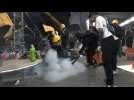 Hong Kong protesters fight back police tear gas