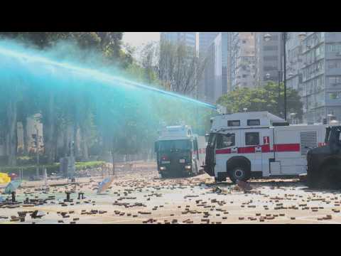 Hong Kong police launch water cannon outside university campus