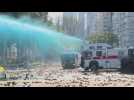 Hong Kong police launch water cannon outside university campus