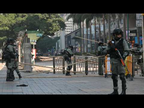 HK police clear barricades near campus protest siege