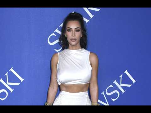 Kim Kardashian West won't talk about her body woes in front of her kids