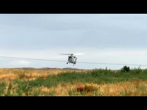 NZ troops launch mission to get bodies off volcano