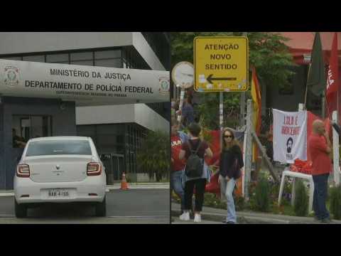 People wait outside police station in Curitiba for Lula's release