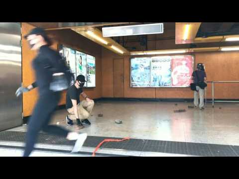 Hong Kong protesters throw bricks inside metro station