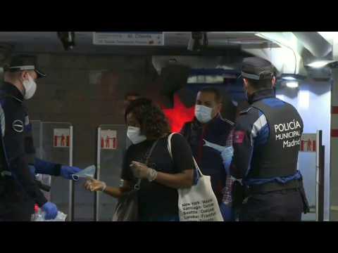 Authorities distribute free masks to commuters in Madrid