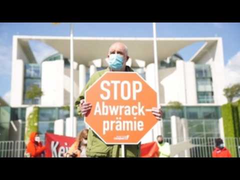Environmental protest in Berlin against government aid to the car industry