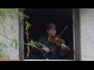 France: musician plays gypsy jazz for neighbors after cheering for health workers