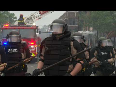 State patrol troopers in the streets of Minneapolis after a night of riots