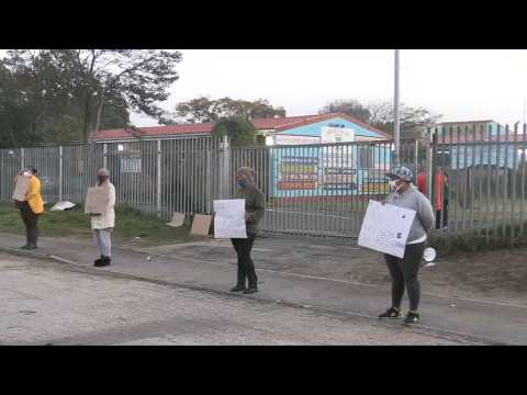 Coronavirus: South African parents protest outside school